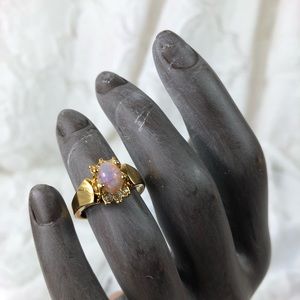 Avon gold tone ring with opal style stone SZ 6.75